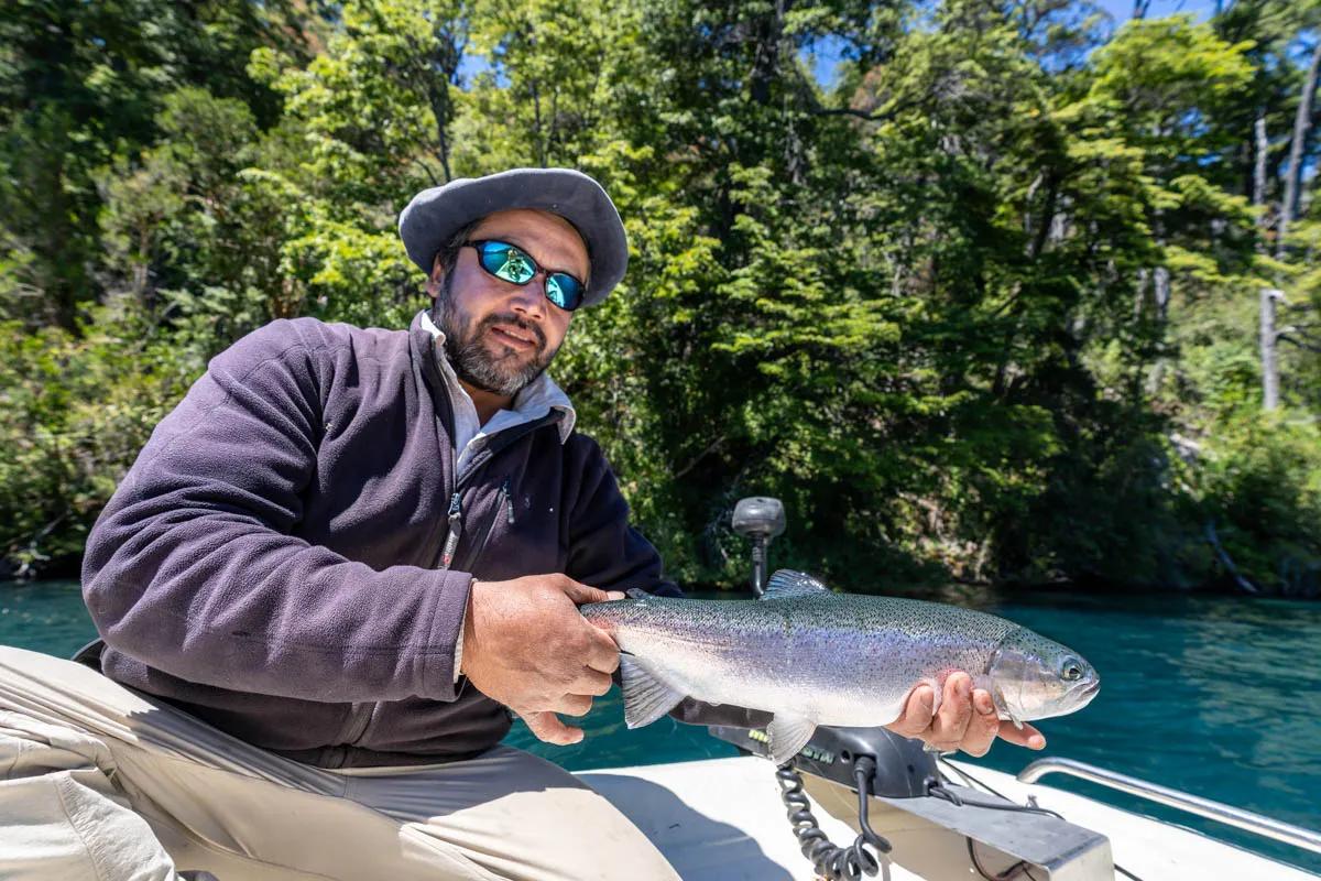 Guide Marcelo holds a nice rainbow trout from Lago Menendez.