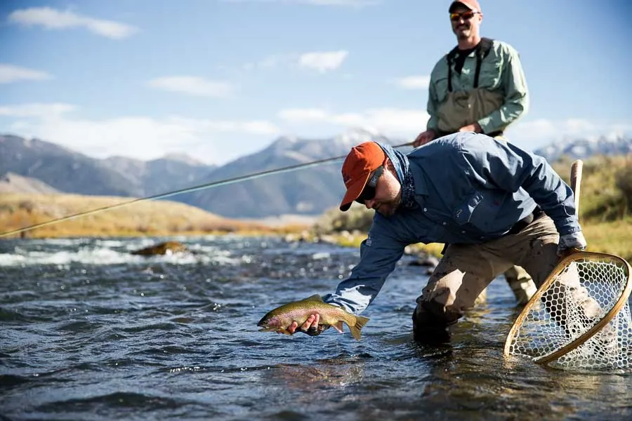 holding fish on madison river