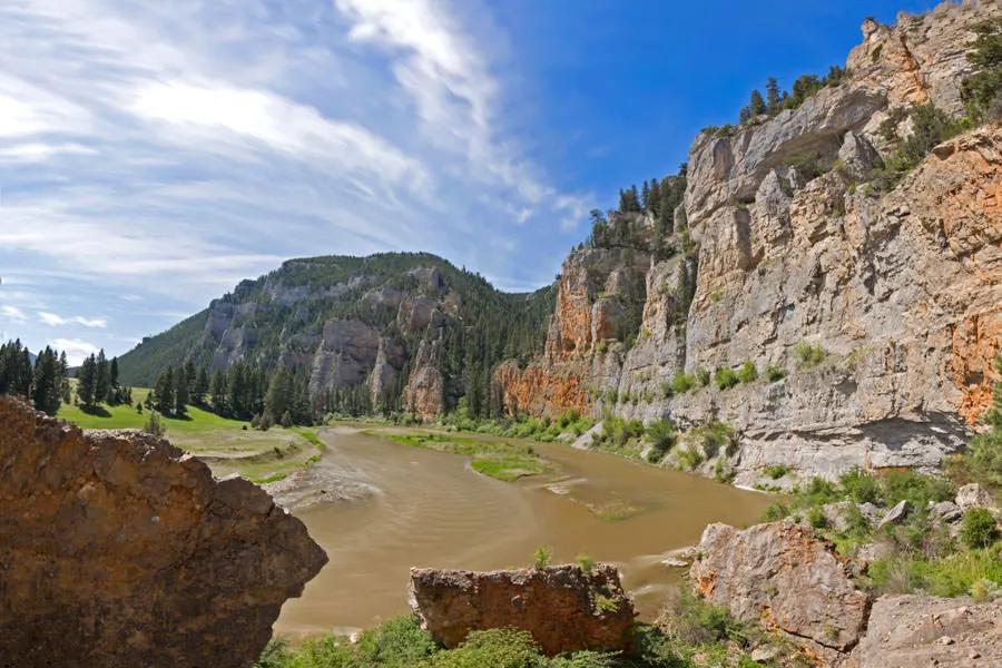 Stained water on the Smith River in Montana "The water clarity can counter act the lighting conditions, if you have a blue bird day with clear skies but stained water trout will be less wary and more active."
