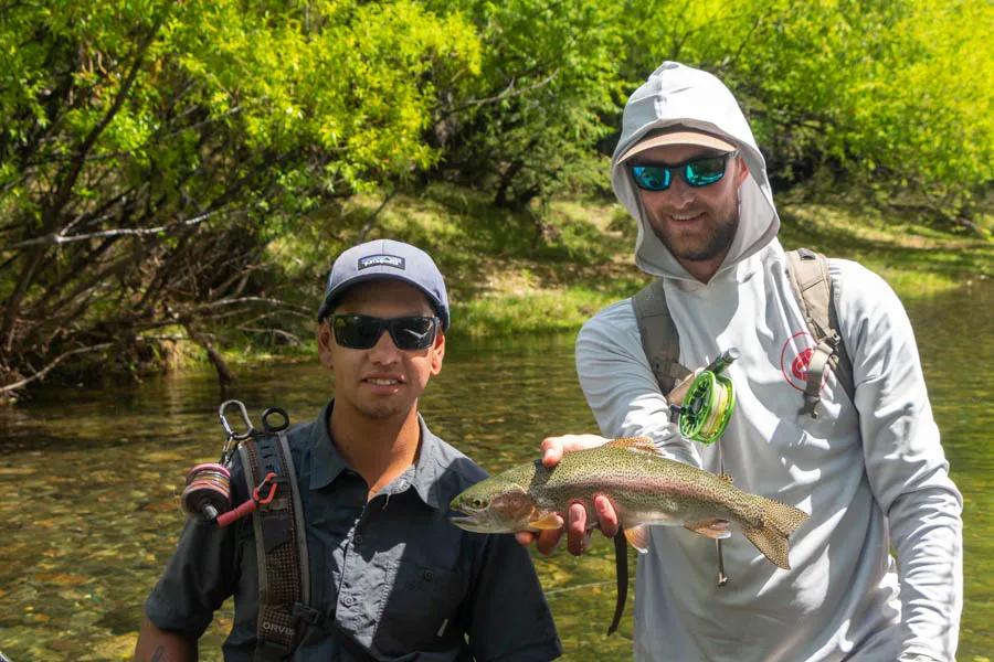 Juan and Keegan celebrate a catch despite a windy day in Patagonia