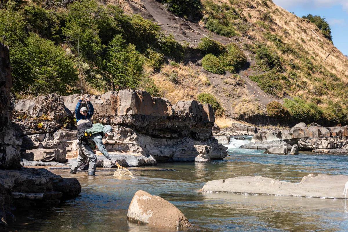 Magic Waters guide Hayden nets a Rio Simpson rainbow trout in the pocket water at the base of the canyon