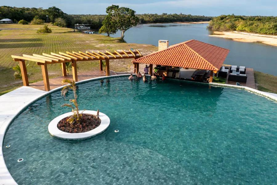 Swim up bar on the Amazon river After a day of working hard on the river the swim up bar is always a popular gathering area