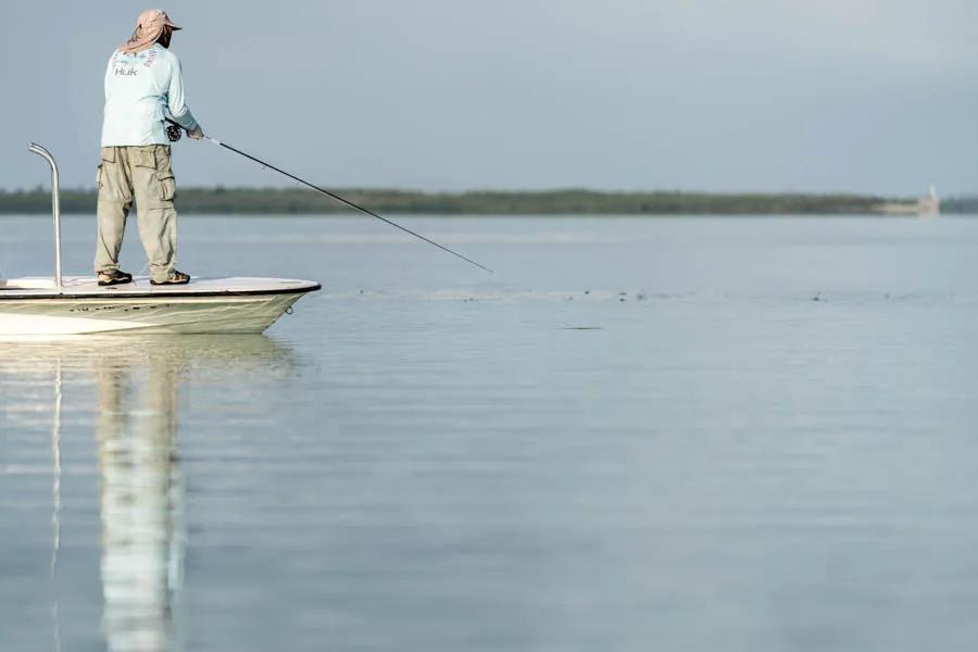 Casting to tailing bonefish in Cuba Sight casting is the norm when fishing the flats. Jay makes a cast to a group of tailing fish on a calm morning.
