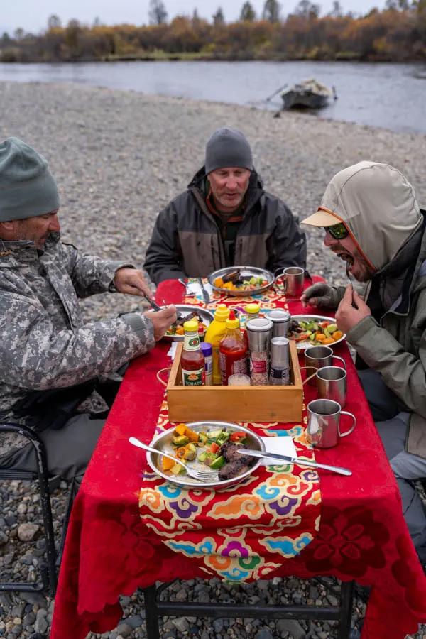 Lunch on the river Hot lunches on the river were a welcome treat! Some days we were fishing in tee-shirt weather, and other days it was cool and in the upper 40s. Very similar to Montana in late September