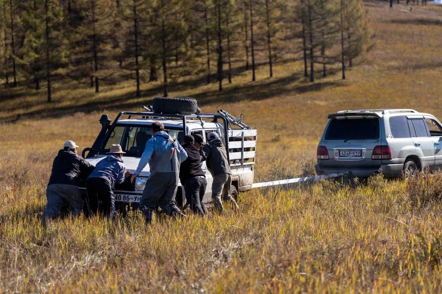 Stuck truck in Mongolia Getting to the river on the launch day was an adventure as our land cruiser got stuck. After a lot of head scratching, winch deployment and old fashioned pushing we were back on our way