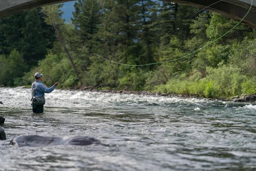 Montana fly fishing tips for fishing waters near Bozeman and Big Sky. Learning to cast a wider loop is a helpful skill when fishing weighted, tandem subsurface rigs. A wide loop reduces the risk of tangles while casting.