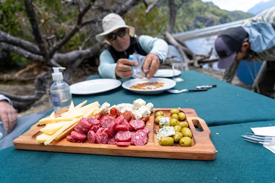 Fly fishing trips in Argentina. Lunch time appetizers hit the spot after fishing the rivers and creeks near Carrileufu River Lodge.