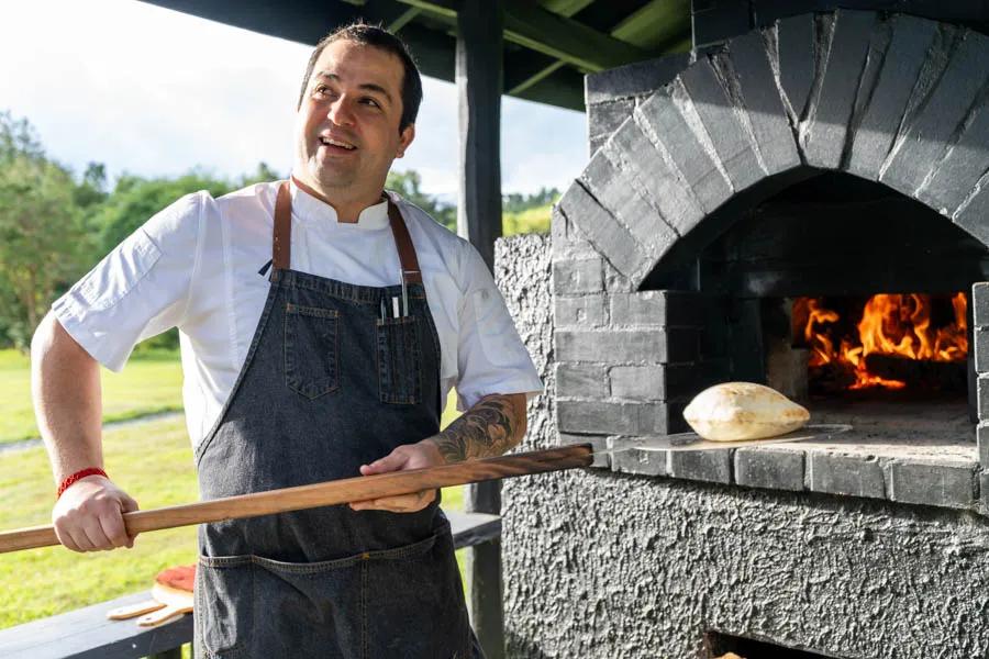 wood fired oven in Chile Chef "Nacho" taking advantage of the outdoor wood fired oven.