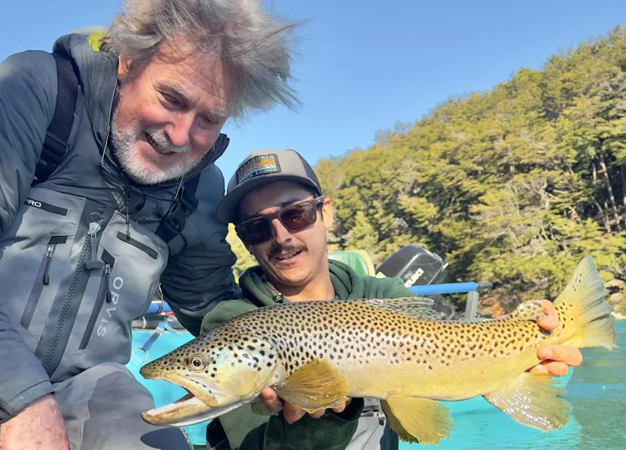 Fly fishing Patagonia Baker Lodge with Montana Angler The Rio Baker's magical blueish color due to heavy glacial flour is the perfect backdrop when holding one of the river's average-sized brown trout.