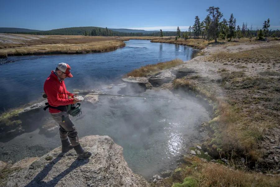 Montana Angler fly fishing trips in Yellowstone National Park The Firehole River is famous for the quality of fishing but equally as stunning is the backdrop--geysers and thermals make for an unforgettable experience.