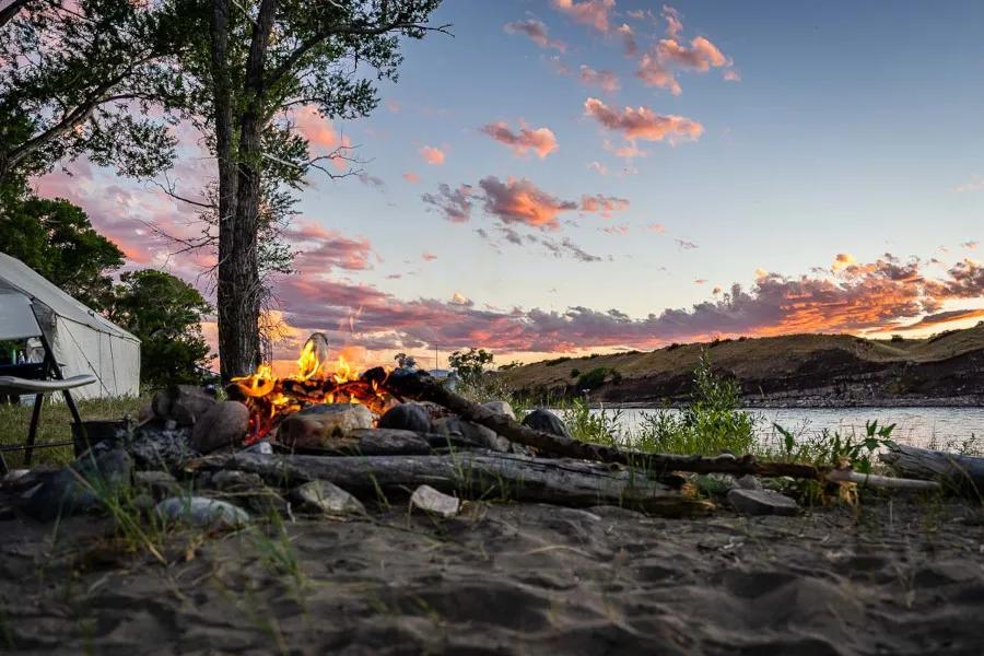 A river camping and fishing trip is a special way to take a Montana fly fishing trip. A fishing lodge has a fixed location, but a river camping trip means you float and fish downstream each day with a different campsite each night. 