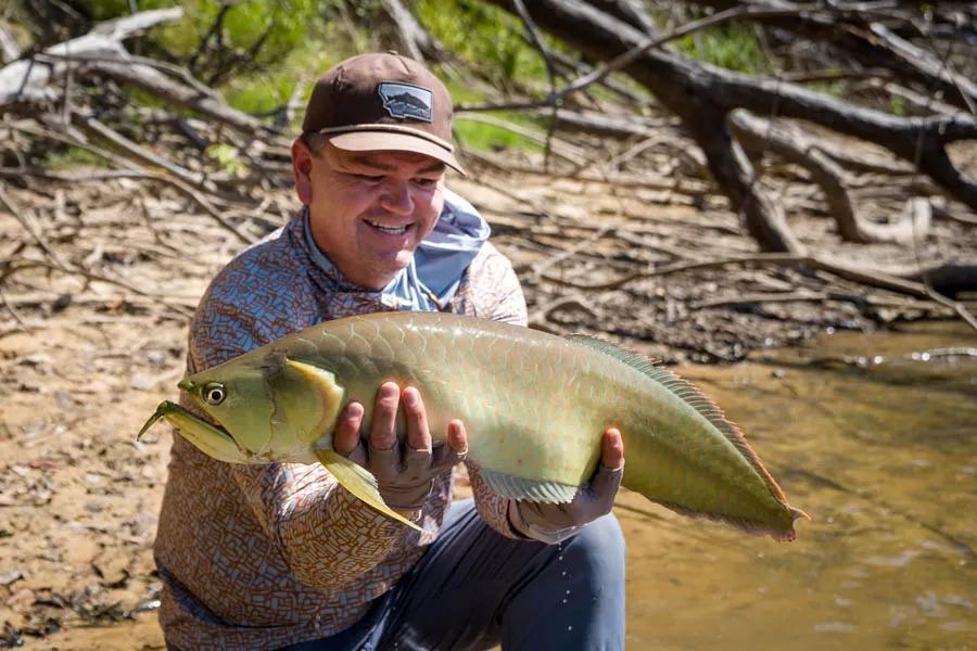 Fly fishing for arowana in Agua Boa River in the Amazon