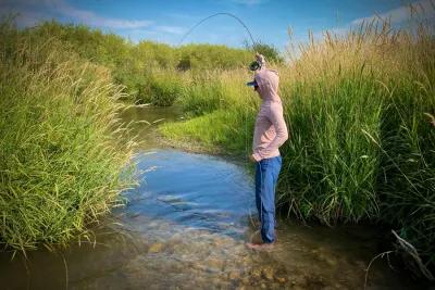 Hooked up while fishing a bamboo rod on a small stream