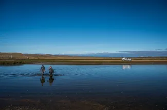 Fishing is done on foot, wading in the river.