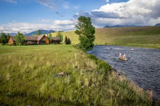 The lodge is located on the banks of the Madison River