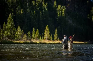 Guide and angler tying one on.