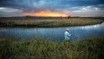 An angler fishing at last light on the East Gallatin River