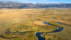 The East Gallatin River flows below the Bridger Mountain Range north of Bozeman, Montana