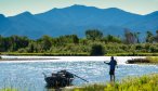 An angler fishes the Jefferson River beneath the peaks of the Tobacco Root Mountains