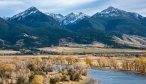 Anglers fish the Yellowstone River beneath the towering peaks of the Absaroka Mountains
