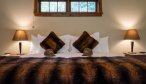 Owen River Lodge room bed
