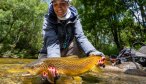 Ann with nice brown trout in New Zealand