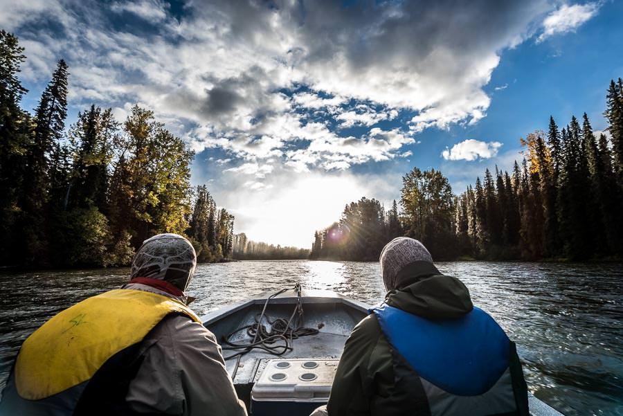 The first rays of sunlight grace a boat ride up river