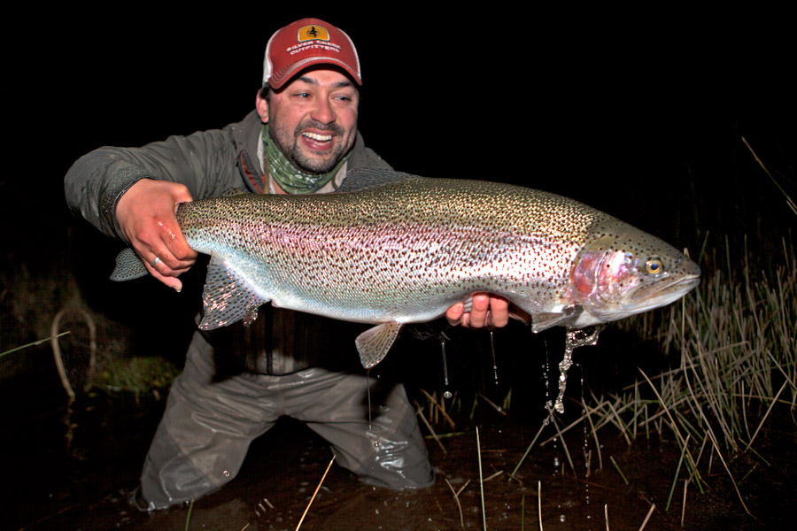 Chile big fish Eduardo landed this 32" rainbow at "Zero" the season before. I got "zeroed" at Zero but did have this fish's twin brother follow my streamer to the boat.