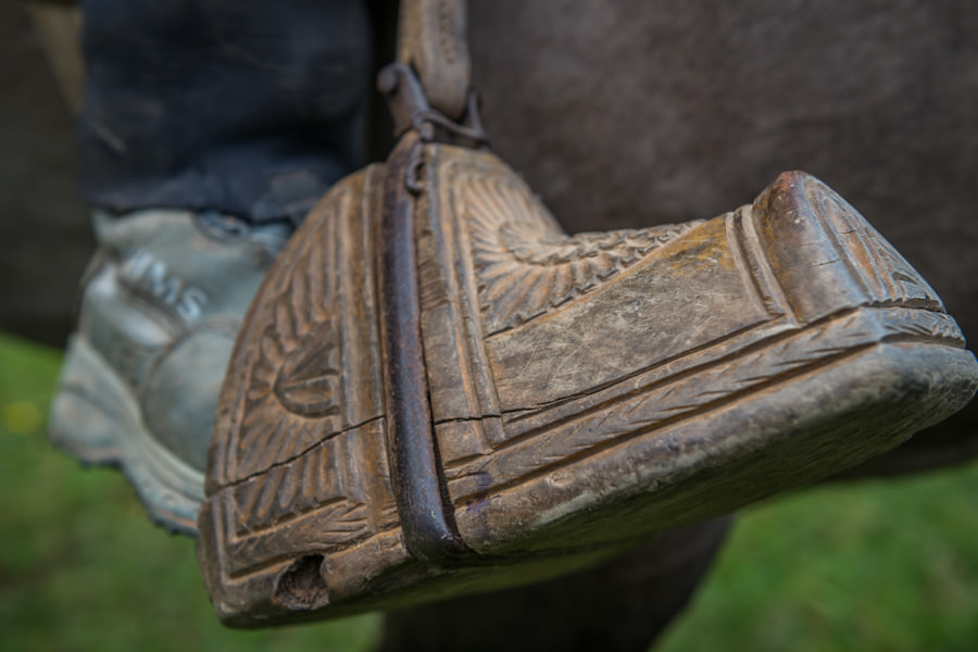 A hand carved stirrup