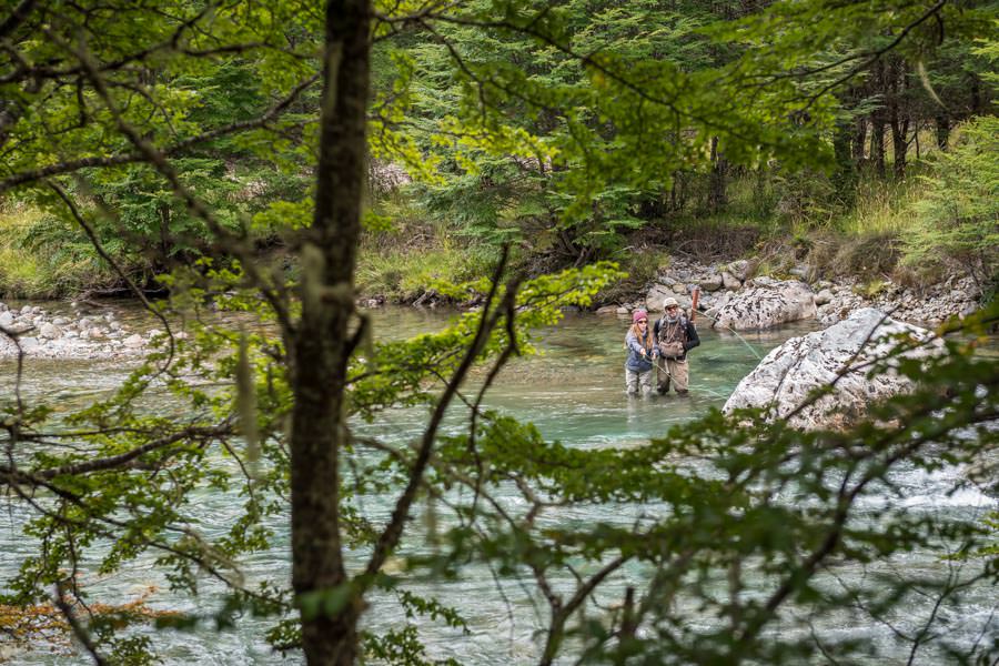 dry fly fishing in Chile Ella and guide Noah fishing large attractor dry flies in the emerald green waters