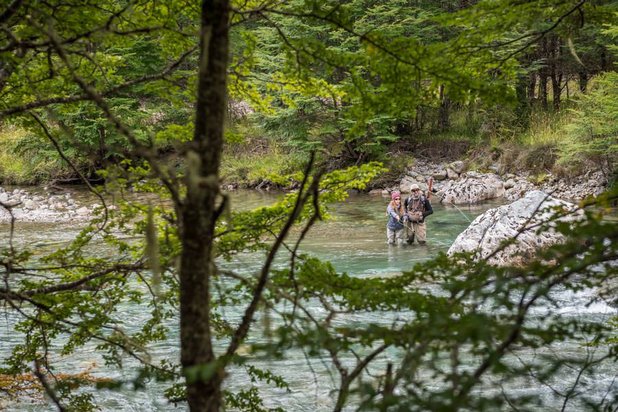 Ella and guide Noah fishing large attractor dry flies in the emerald green waters