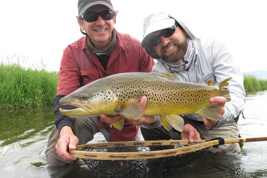 Big trout like this can easily slice through 5x tippet. This 24" brown was landed using a small streamer in a spring creek. Even though the fish was in gin clear water we rigged up to 2X just in case and it paid off
