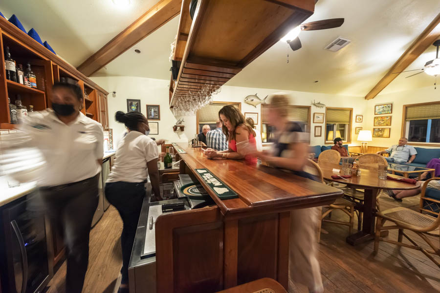 Gathering in the main lodge before dinner. Turneffe's lodge program is one of the best in Belize