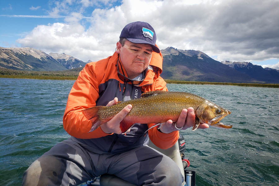 Montana Angler's Jimmy Armijo-Grover holds a trophy brook trout on Lago Engano