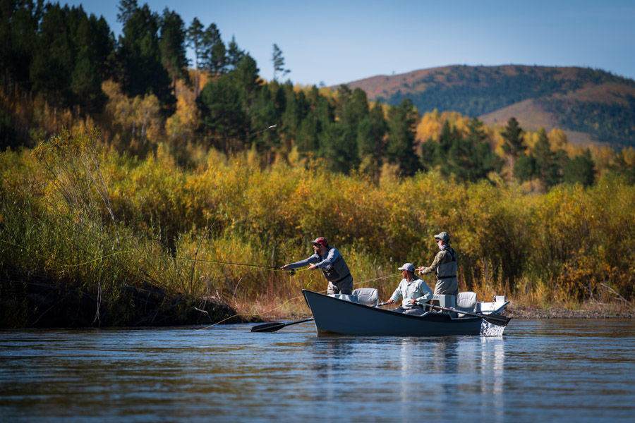 MA guest Paul Shibley sends a big streamer towards a productive current seam in search of taimen.